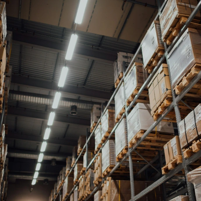 brown cardboard boxes on white metal rack